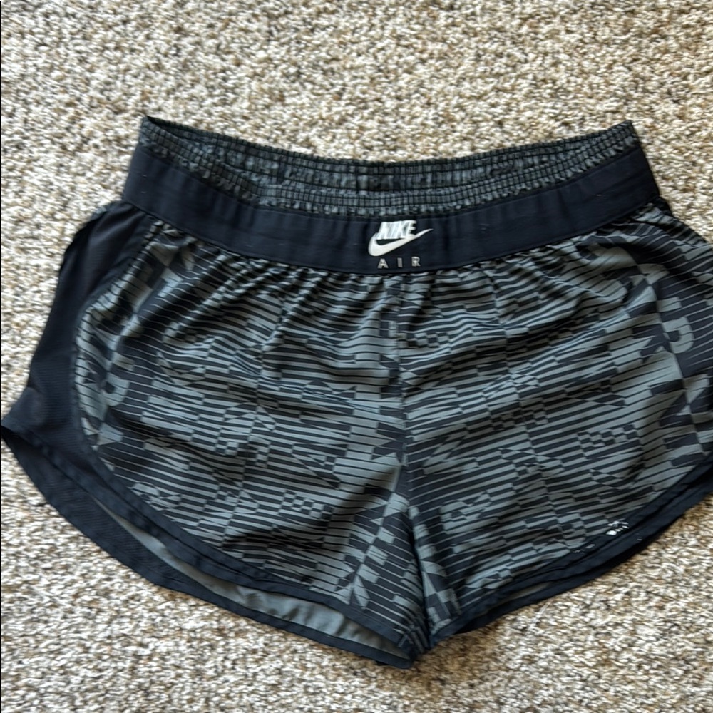 Nike Air -Black Athletic Shorts with Curved Hem and Elastic Waistband
